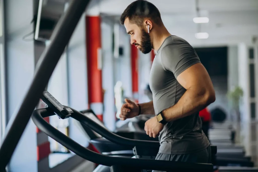 man on a treadmill in a gym 