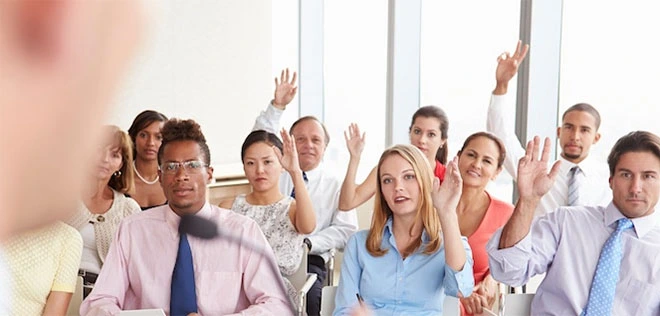 Hands up in a conversation group